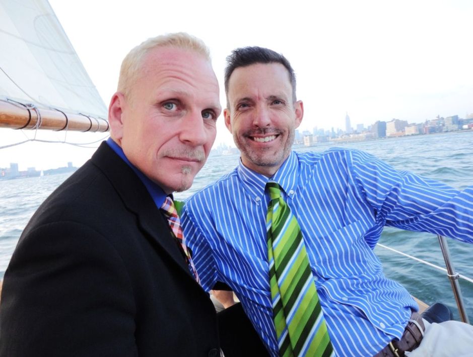 Two guys in a boat as they travel around with love