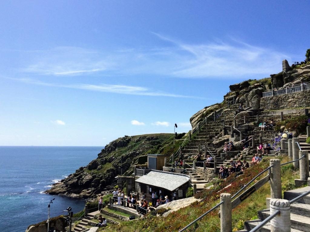 Seating area of Minack Theatre with people sitting